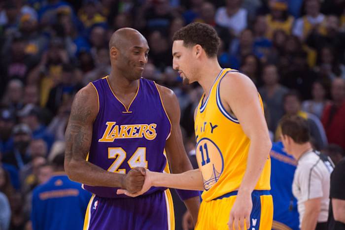 November 24, 2015; Oakland, CA, USA; Los Angeles Lakers forward Kobe Bryant (24) shakes hands with Golden State Warriors guard Klay Thompson (11) before the game at Oracle Arena. The Warriors defeated the Lakers 111-77. Mandatory Credit: Kyle Terada-USA TODAY Sports